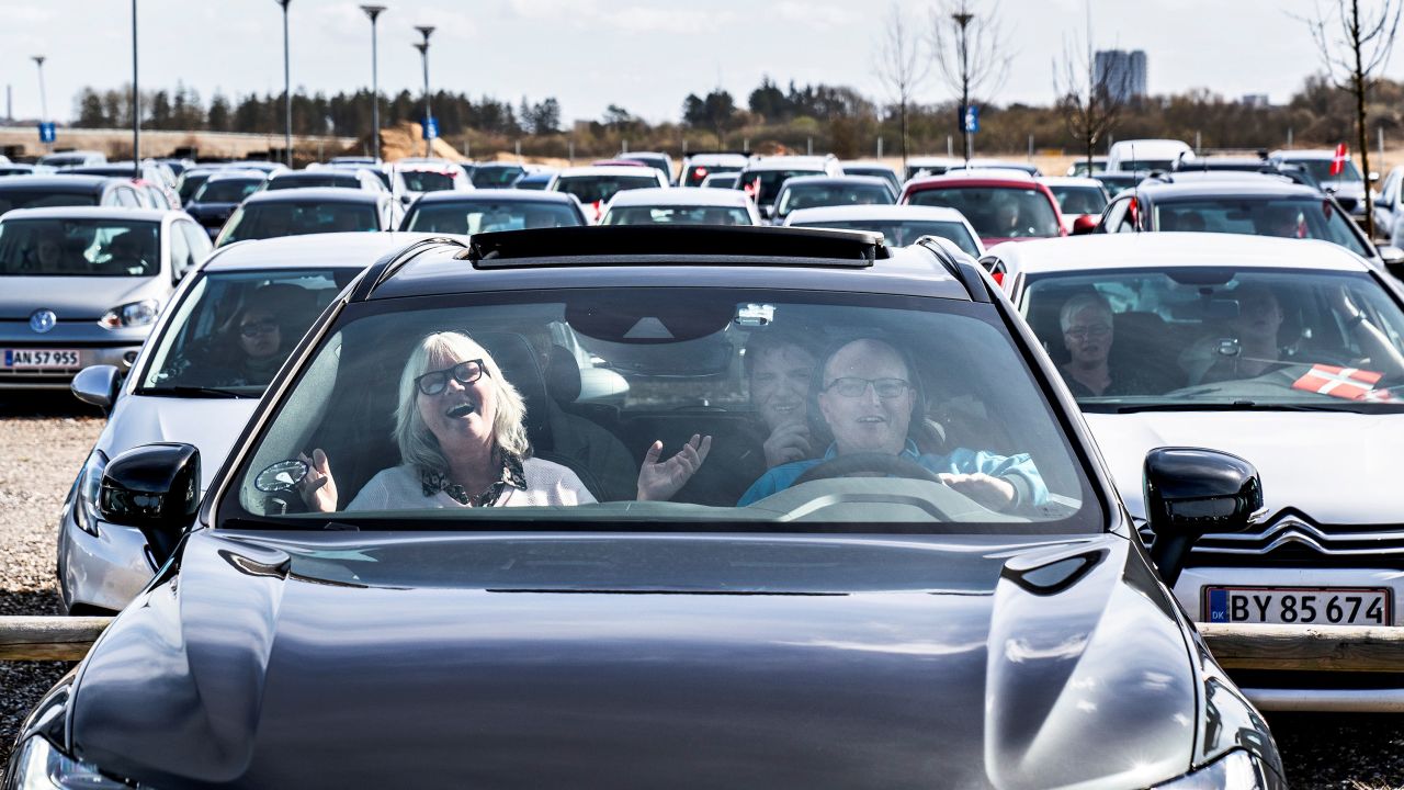 People sing hymns inside their cars during a drive-in Easter at the parking lot at Allborg Airport in Denmark on Sunday.