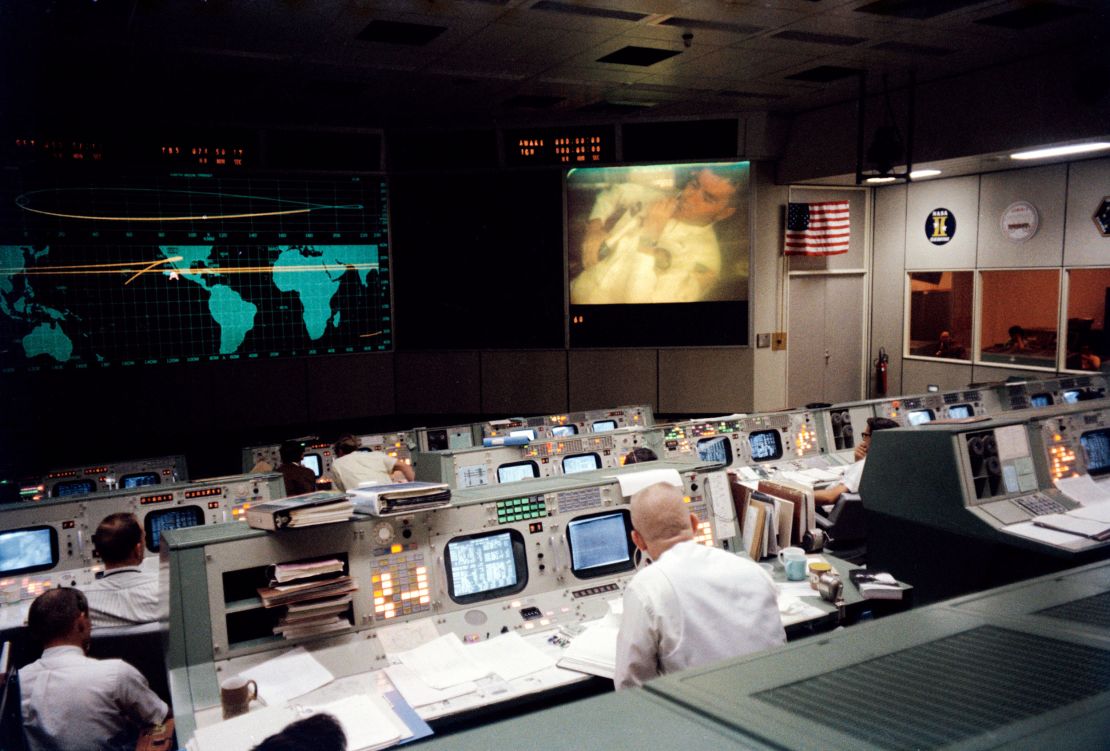 Gene Kranz, wearing his famous white vest, sits in Houston's Mission Operations Control Room  and watches Fred Haise' television broadcast from space. during the fourth television broadcast.