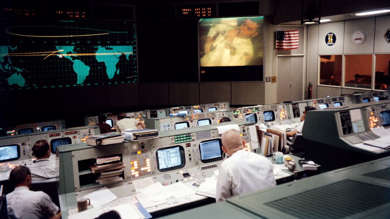 Gene Kranz, wearing his famous white vest, sits in Houston's Mission Operations Control Room  and watches Fred Haise' television broadcast from space. during the fourth television broadcast.