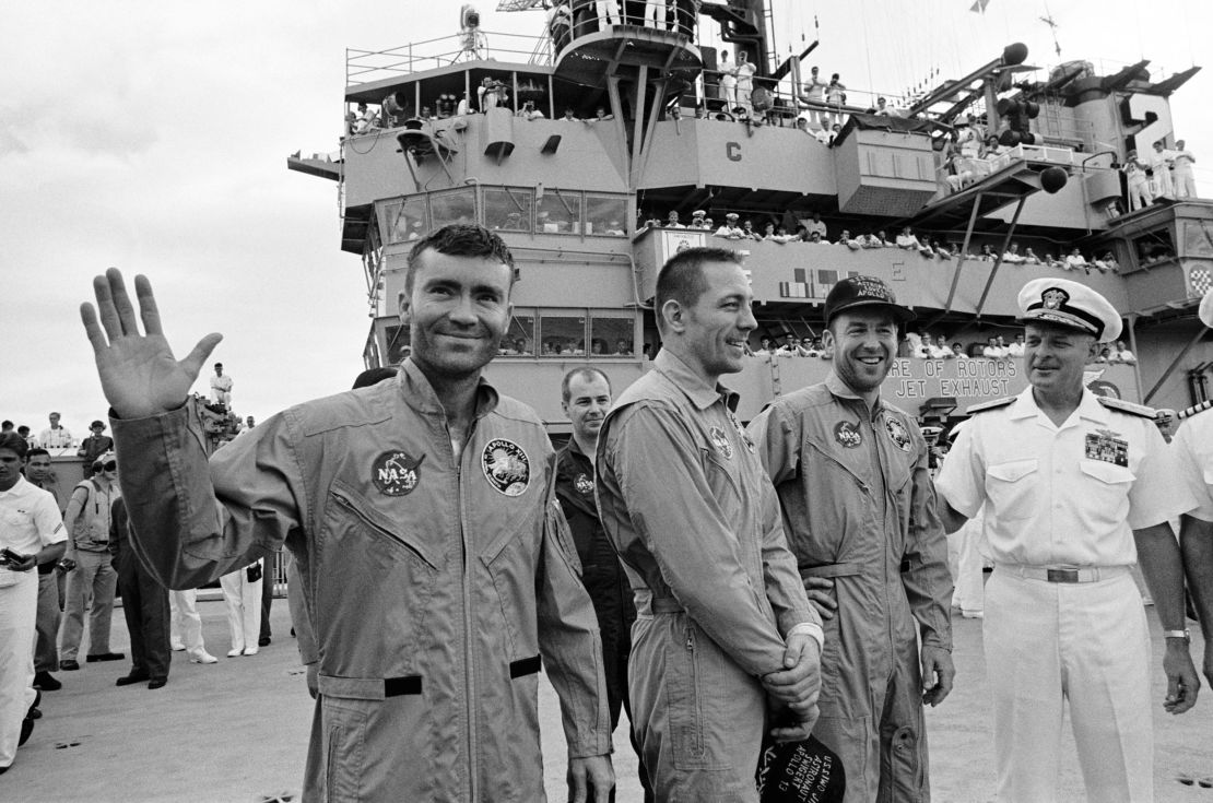 The USS Iwo Jima was the prime recovery ship for the Apollo 13 mission. The crewmembers (from the left) astronauts Fred W. Haise Jr. (waving), lunar module pilot; John L. Swigert Jr., command module pilot; and James A. Lovell Jr., commander; were transported by helicopter to the ship following a smooth splashdown.