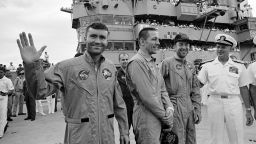 S70-35606 (17 April 1970) --- Rear Admiral Donald C. Davis, Commanding Officer of Task Force 130, the Pacific Recovery Forces for the Manned Spacecraft Missions, welcomes the Apollo 13 crewmembers aboard the USS Iwo Jima, prime recovery ship for the Apollo 13 mission. The crewmembers (from the left) astronauts Fred W. Haise Jr. (waving), lunar module pilot; John L. Swigert Jr., command module pilot; and James A. Lovell Jr., commander; were transported by helicopter to the ship following a smooth splashdown only about four miles from the USS Iwo Jima. Splashdown occurred at 12:07:44 p.m. (CST), April 17, 1970, to conclude safely a perilous space flight.