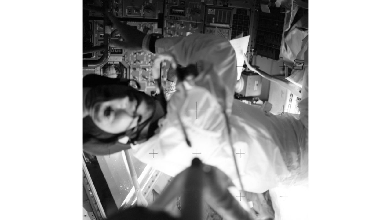 Lovell is pictured in the Lunar Module during a TV broadcast. 
