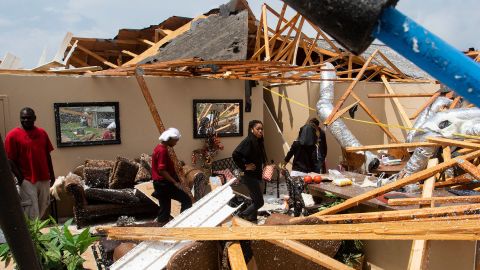 Residents look at the remains of their home after a tornado ripped through Monroe, Louisiana, on Easter Sunday.