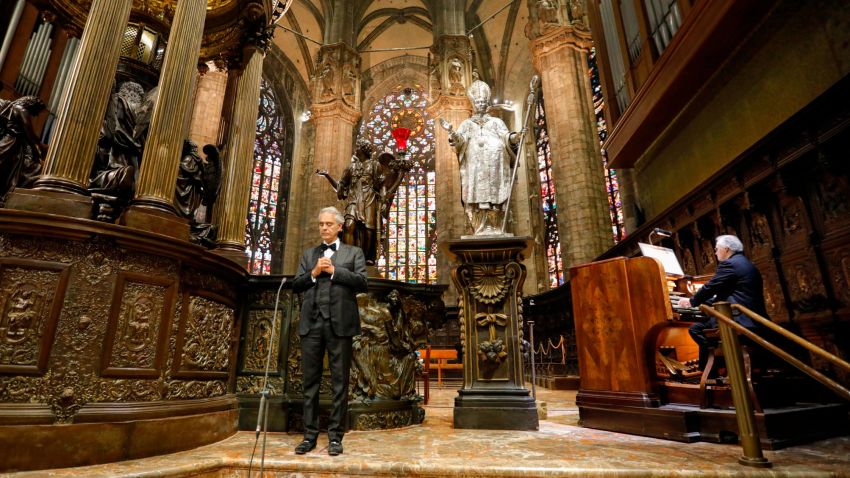 Italian singer Andrea Bocelli, left, performs inside an empty Duomo cathedral, on Easter Sunday, in Milan, Italy, April 12, 2020. Bocelli was invited by Milan's Mayor Giuseppe Sala to perform an Easter concert inside an empty Duomo due to the lockdown measures to prevent the spread of Covid-19. The new coronavirus causes mild or moderate symptoms for most people, but for some, especially older adults and people with existing health problems, it can cause more severe illness or death. (Luca Rossetti/Sugar Srl, Decca Records via AP)
