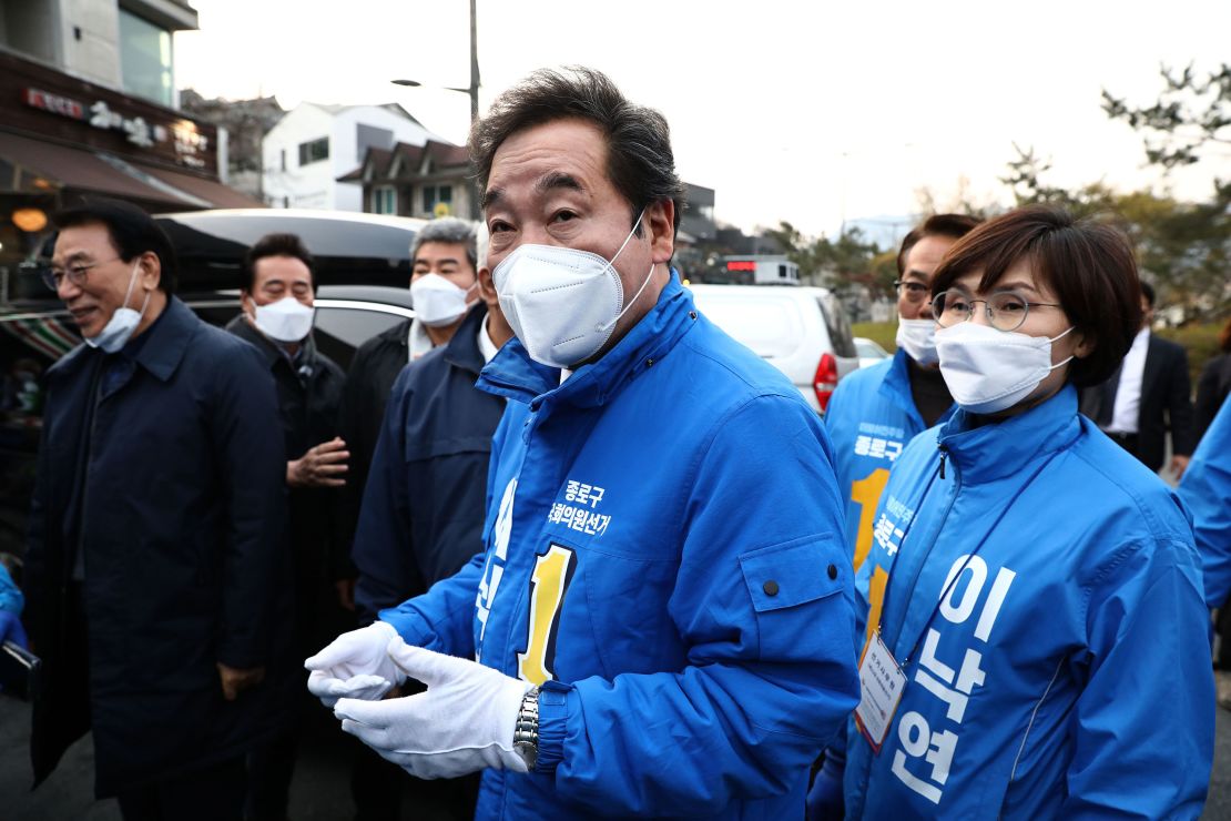 Lee Nak-yeon, a candidate of the ruling Democratic Party, wears a mask as he meets with supporters on April 10 in Seoul, South Korea. 