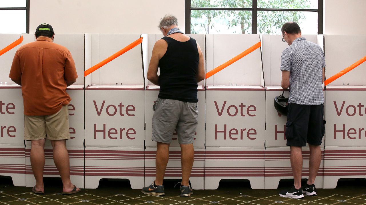 Voters keep a distance in Brisbane, Australia, on March 28.
