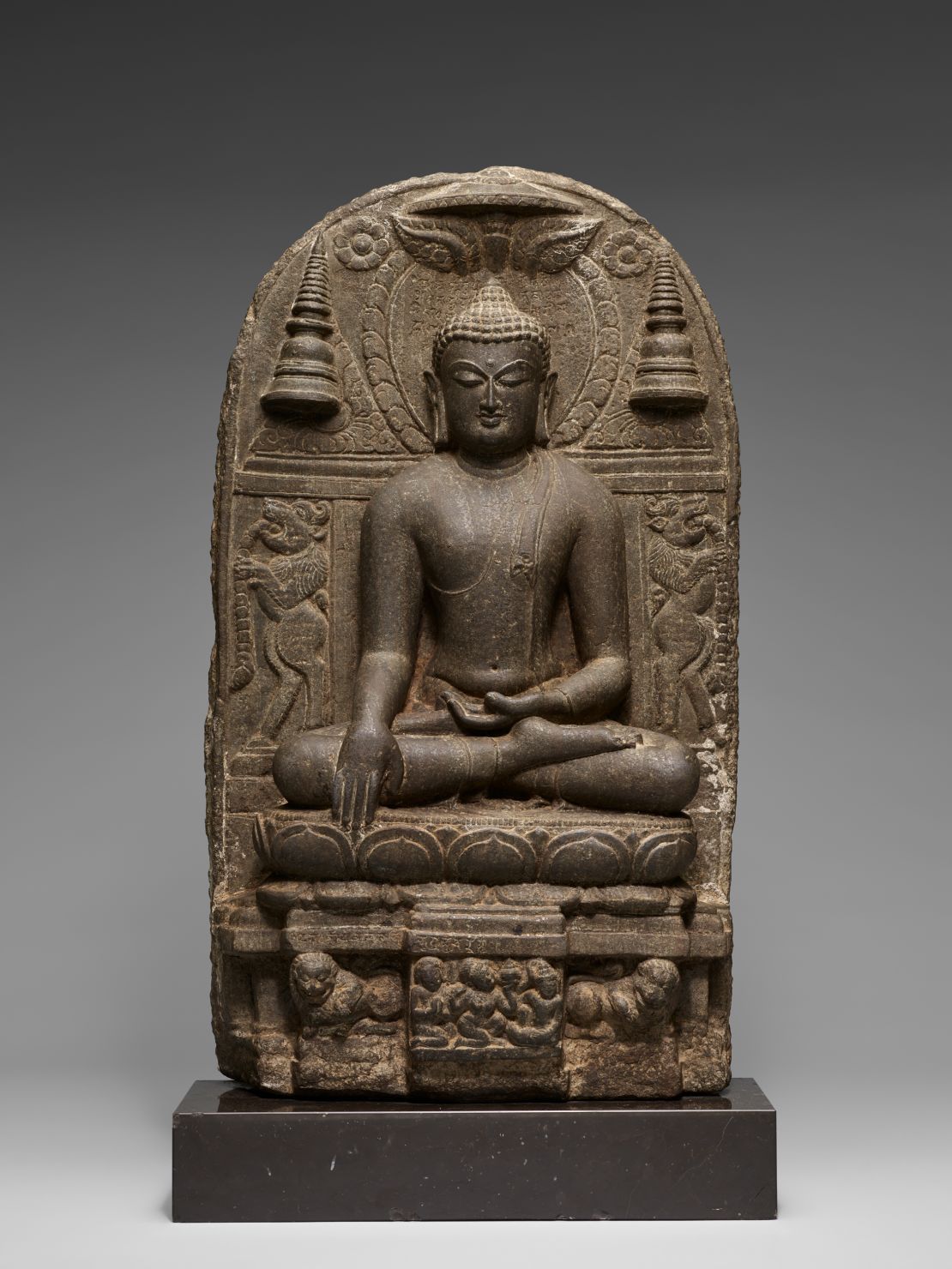 The Buddha triumphing over Mara, a statue in stone from Bihar state, India (approximately 800-900). Part of the Avery Brundage Collection at the Asian Art Museum, San Francisco