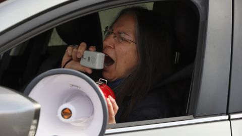 Protester Debra Cohen speaks into a megaphone at a demonstration against Immigration and Customs Enforcement in Hartford, Connecticut, on April 2.