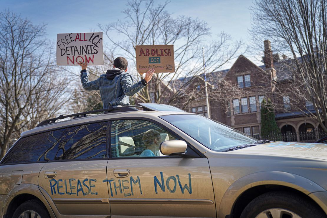 Activists who stayed mostly in their cars for social distancing honked horns outside the Governor's Residence in St. Paul, Minnesota, on March 27.