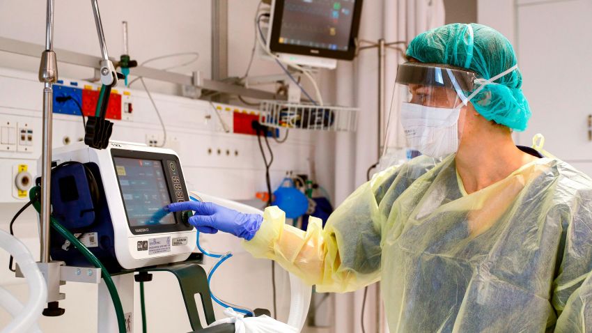 This picture taken on March 16, 2020 during a press presentation of the hospitalisation service for future patients with coronavirus at Samson Assuta Ashdod University Hospital in the southern Israeli city of Ashdod, shows the director of the epidemics service Dr Karina Glick checking a medical ventilator control panel at a ward, while wearing protective clothing. - As of March 16, Israel has 255 confirmed cases of coronavirus with no fatalities but tens of thousands in home-quarantine. Authorities have banned gatherings of more than 10 people and ordered schools, universities, restaurants and cafes to close, among other measures. (Photo by JACK GUEZ / AFP) (Photo by JACK GUEZ/AFP via Getty Images)