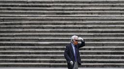 ROME, ITALY - 2020/04/13: A man wearing face mask walks at Spanish Steps. Empty streets in the city centre during Coronavirus (Covid-19) emergency in Rome. (Photo by Davide Fracassi/Pacific Press/LightRocket via Getty Images)