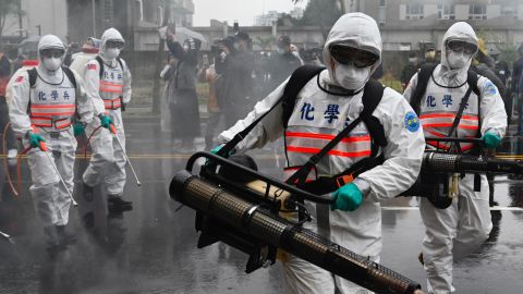 Soldiers from the military's chemical units take part in a drill to help slow the coronavirus' spread in the Xindian district near Taipei on March 14 