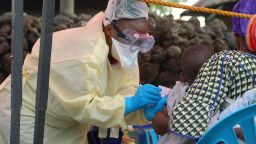 A child receives a vaccine against Ebola from a nurse in Goma on August 7, 2019. - Three cases of the deadly virus was detected in the border city of Goma, the Congolese presidency said on August 1, 2019.