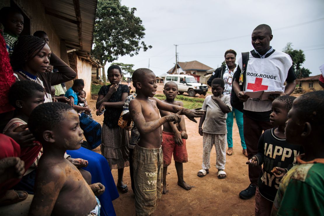 Medical teams in Beni, DRC talk to local community memberss on August 31, 2019. 