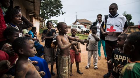 Red Cross members go door-to-door in Beni, in the Democratic Republic of Congo, to talk to families about the Ebola virus in August 2019.