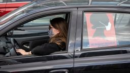 A woman drives her car during a protest of Polish women's rights activists using their cars and bicycles to block central Warsaw against a draft legislation that would ban the abortion of foetuses with congenital birth defects, on April 14, 2020. - Poland's parliament is expected to debate fresh efforts to further tighten what is already one of Europe's most restrictive abortion laws. (Photo by Wojtek RADWANSKI / AFP) (Photo by WOJTEK RADWANSKI/AFP via Getty Images)