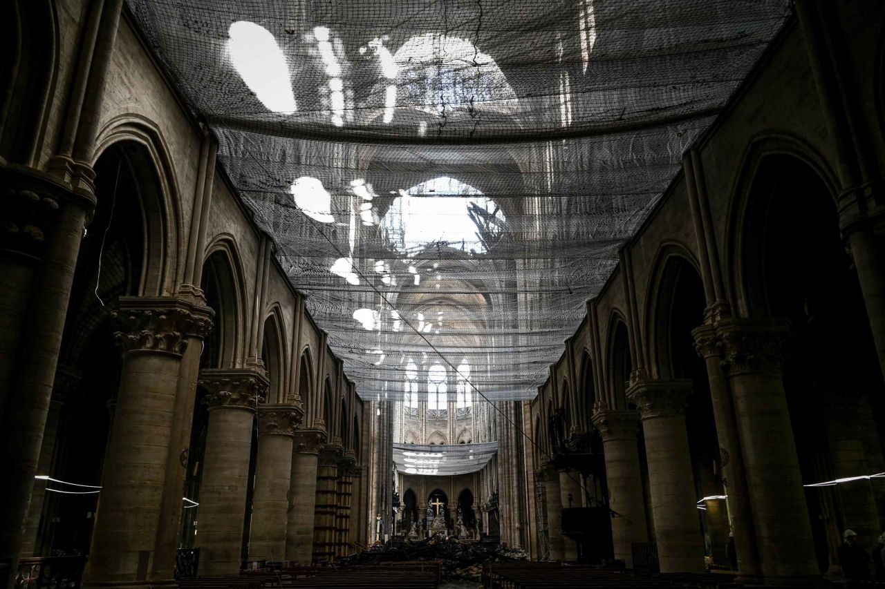A protective net is seen installed at Notre Dame de Paris Cathedral during preliminary work on May 15, 2019, one month after the fire.