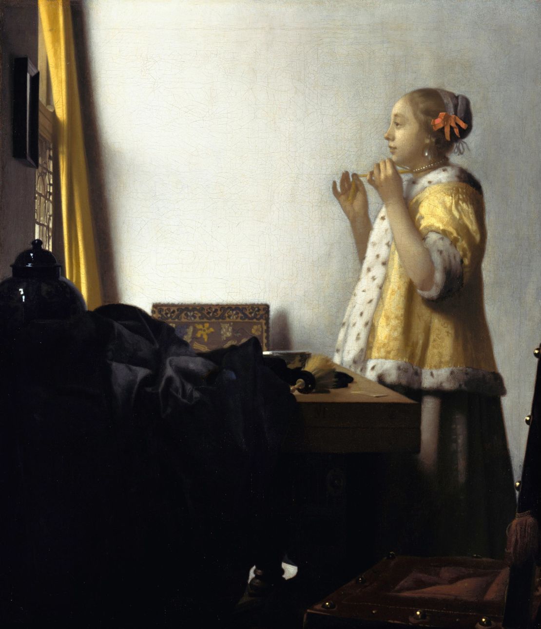 Vermeer's "Young Woman with a Pearl Necklace" (1664)