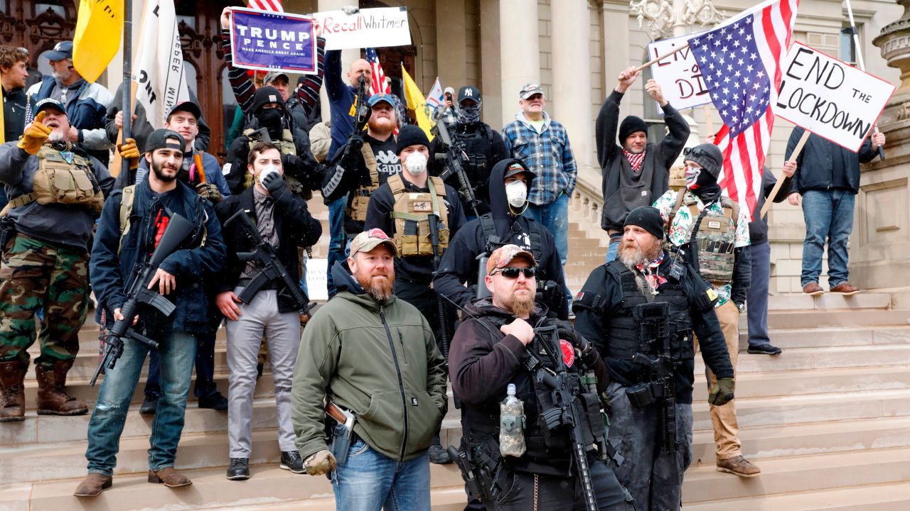 People take part in a protest for "Michiganders Against Excessive Quarantine" at the Michigan State Capitol in Lansing, Michigan on April 15, 2020. - The group is upset with Michigan Governor Gretchen Whitmer's(D-MI) expanded the states stay-at-home order to contain the spread of the coronavirus. (Photo by JEFF KOWALSKY / AFP) (Photo by JEFF KOWALSKY/AFP via Getty Images)