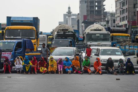 Workers from the garment sector in Dhaka, Bangladesh, block a road during a protest demanding payment of unpaid wages.
