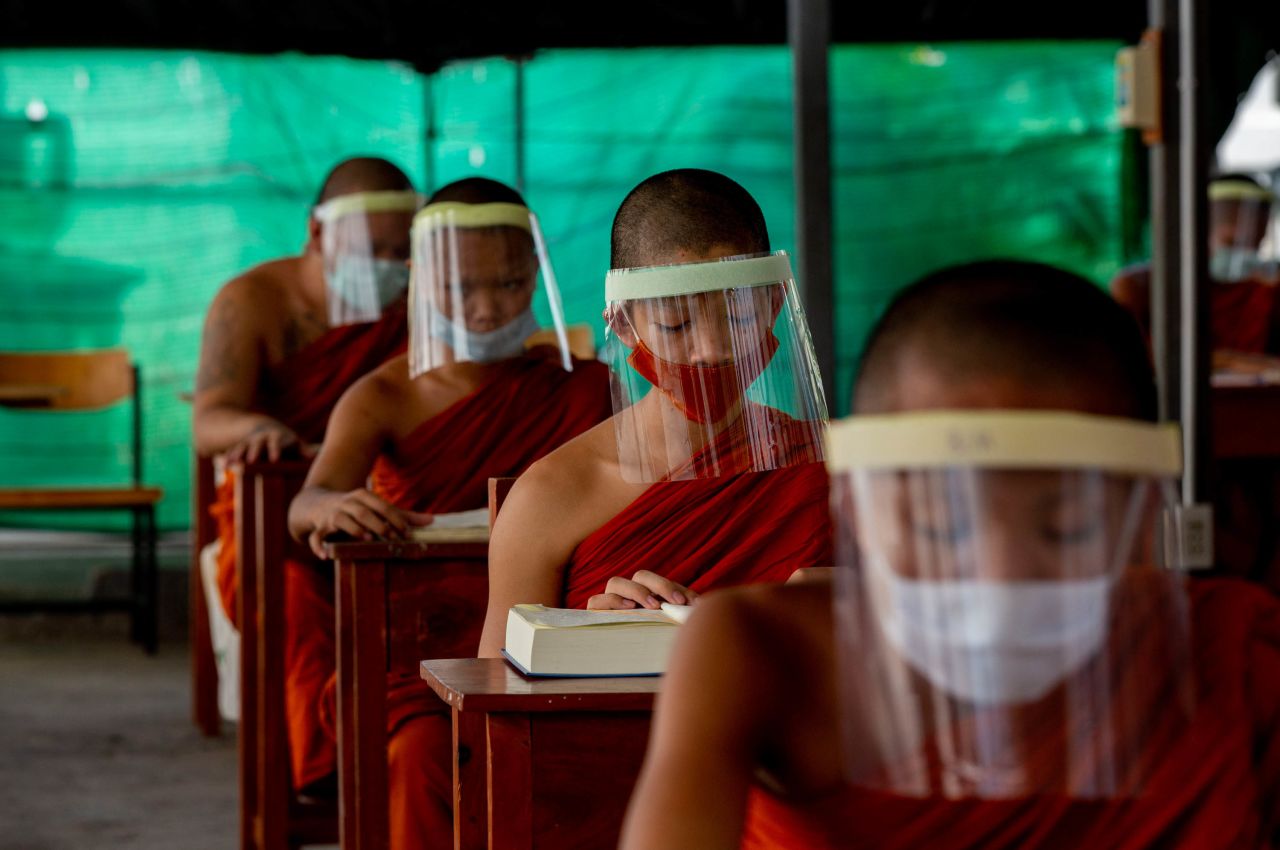 Novice Buddhist monks wear face shields at the Molilokayaram Educational Institute in Bangkok, Thailand, on April 15, 2020.