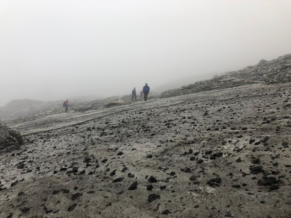 The upper part of the Lendbreen ice patch can be seen after the big melt in 2019. The surface of the ice is covered with horse dung left on the pass when it was originally used.