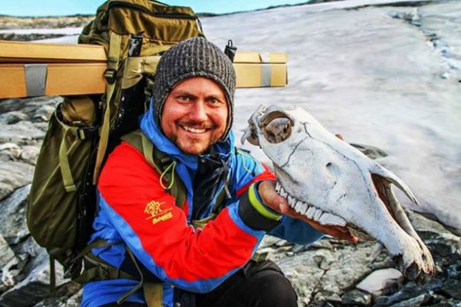 Researcher Elling Utvik Wammer holds the skull of an unlucky packhorse that did not survive its journey. The skull was dated to 1700 AD, making it the most recent item found at the site.