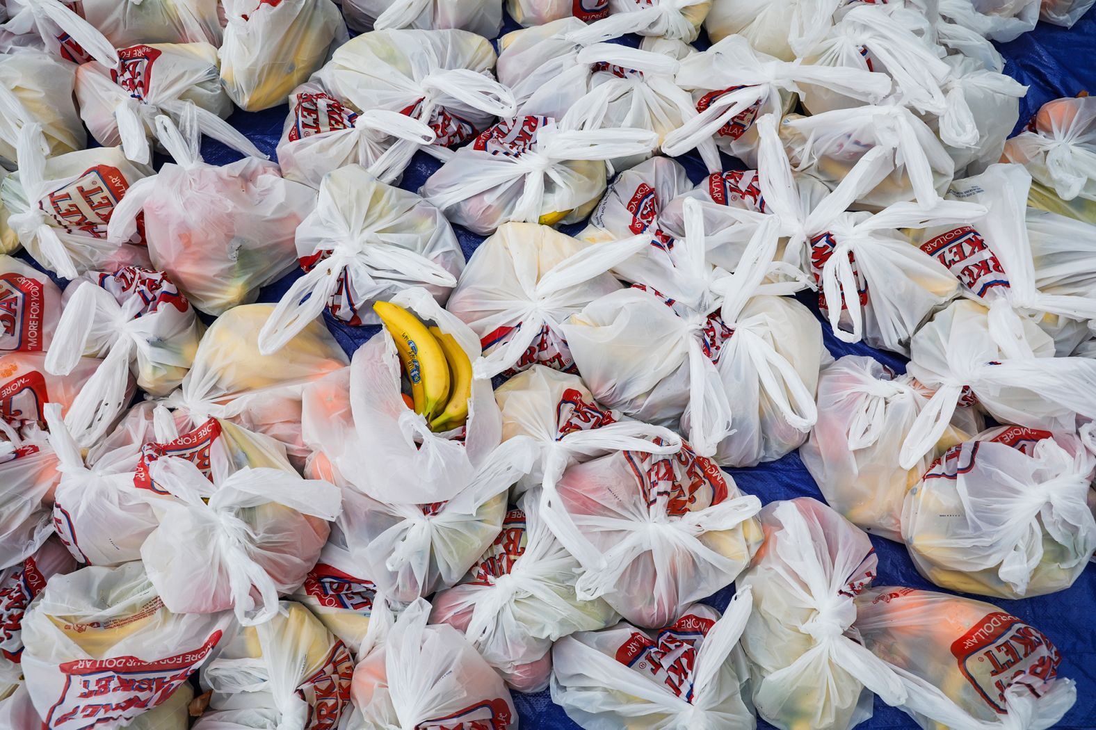 Bags of fruit await residents during a food drive in Waltham, Massachusetts.