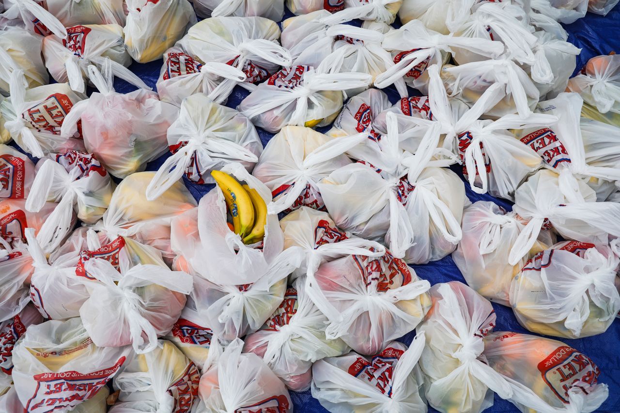 Bags of fruit await residents during a food drive in Waltham, Massachusetts.