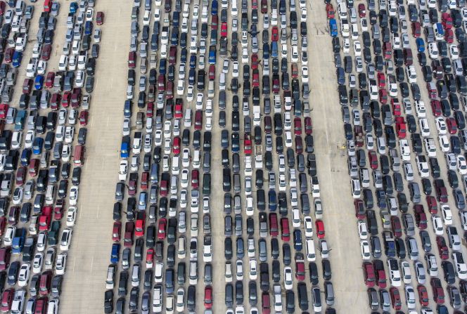 People wait in their cars for the San Antonio Food Bank to begin distributing food in April.