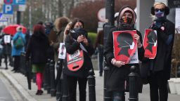 Women's rights activists, wearing masks against the spread of the coronavirus, protest against a draft law tightening Poland's strict abortion rules.
