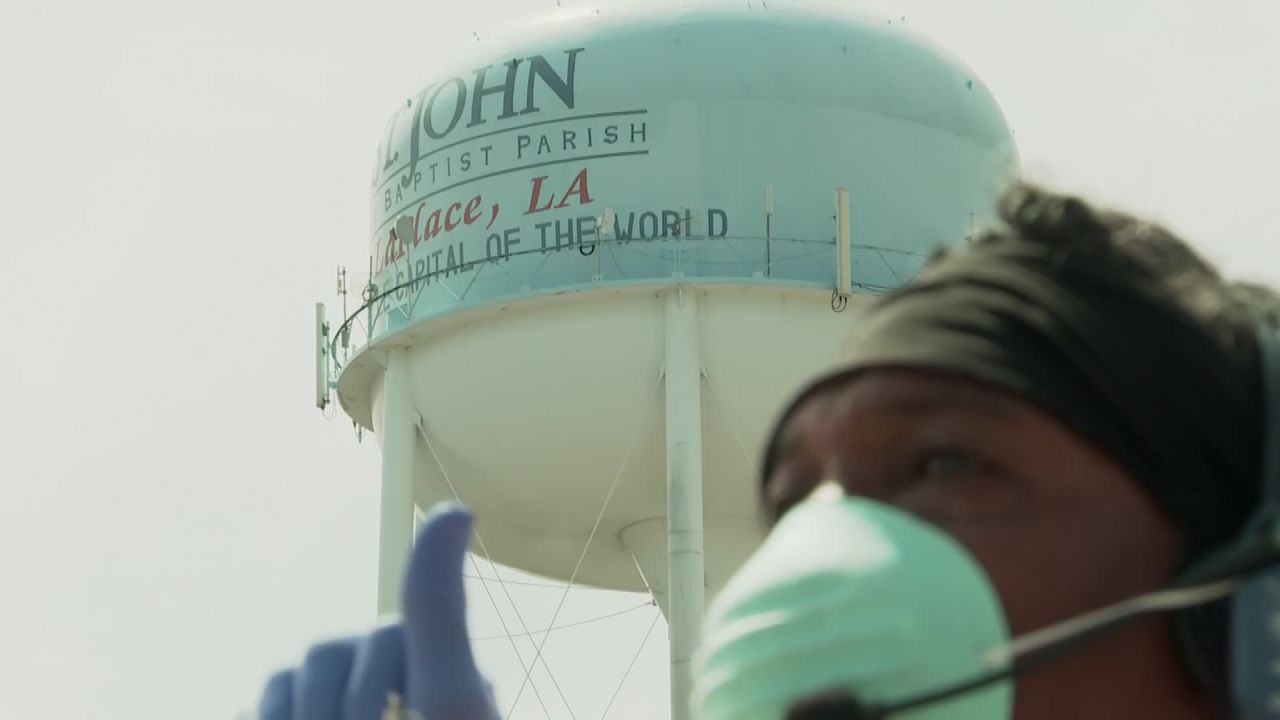A man wears a facemask and gloves during the coronavirus outbreak in St. John the Baptist Parish.
