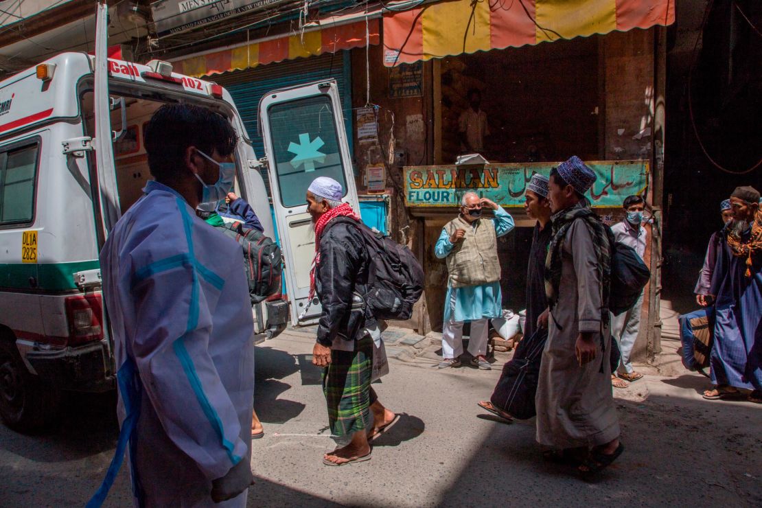 Muslims of Tabhleegi Jamaat from Indonesia board ambulances that will take them to a quarantine facility on April 3, 2020 in New Delhi.