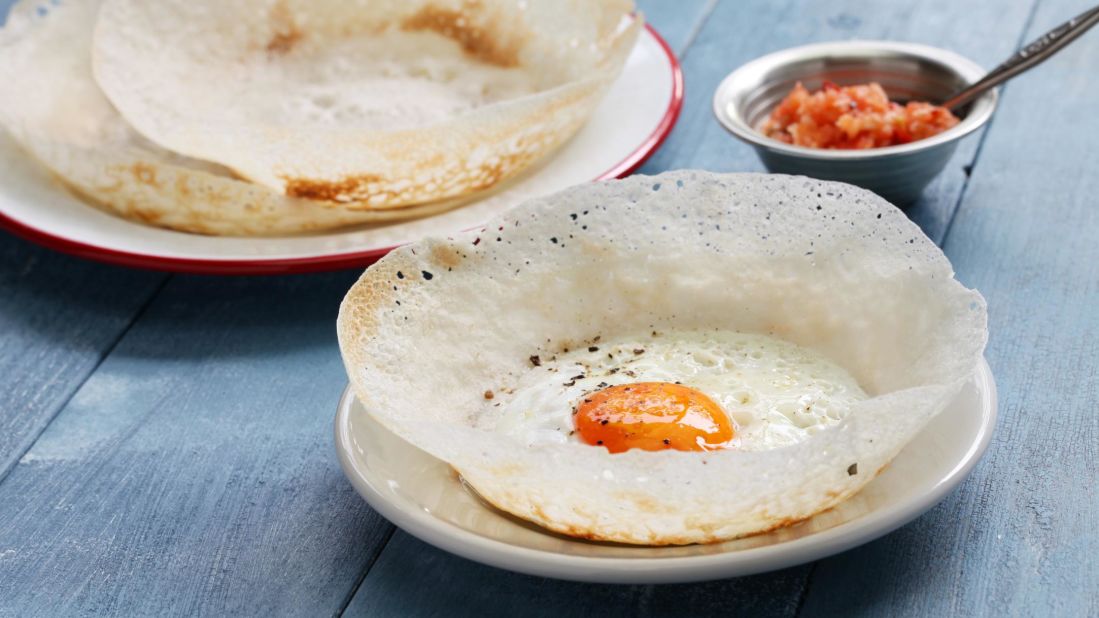 <strong>Hopper</strong>: This Sri Lankan staple looks a bit like a crepe, made from fermented rice flour and served with coconut milk, spices and — for maximum flavor — an egg.