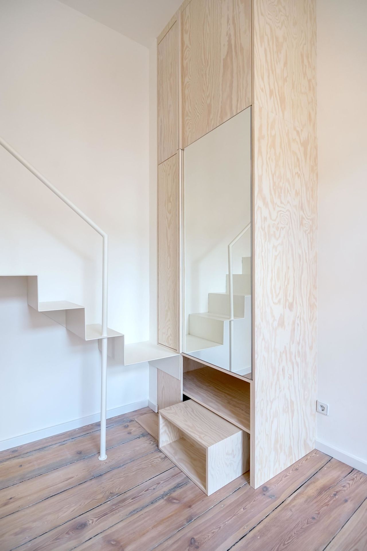 Mirrors can help create the illusion of space, as seen in Micro Apartment Moabit, a 226-square-foot studio apartment in Berlin designed by architects Paola Bagna and John Paul Coss.