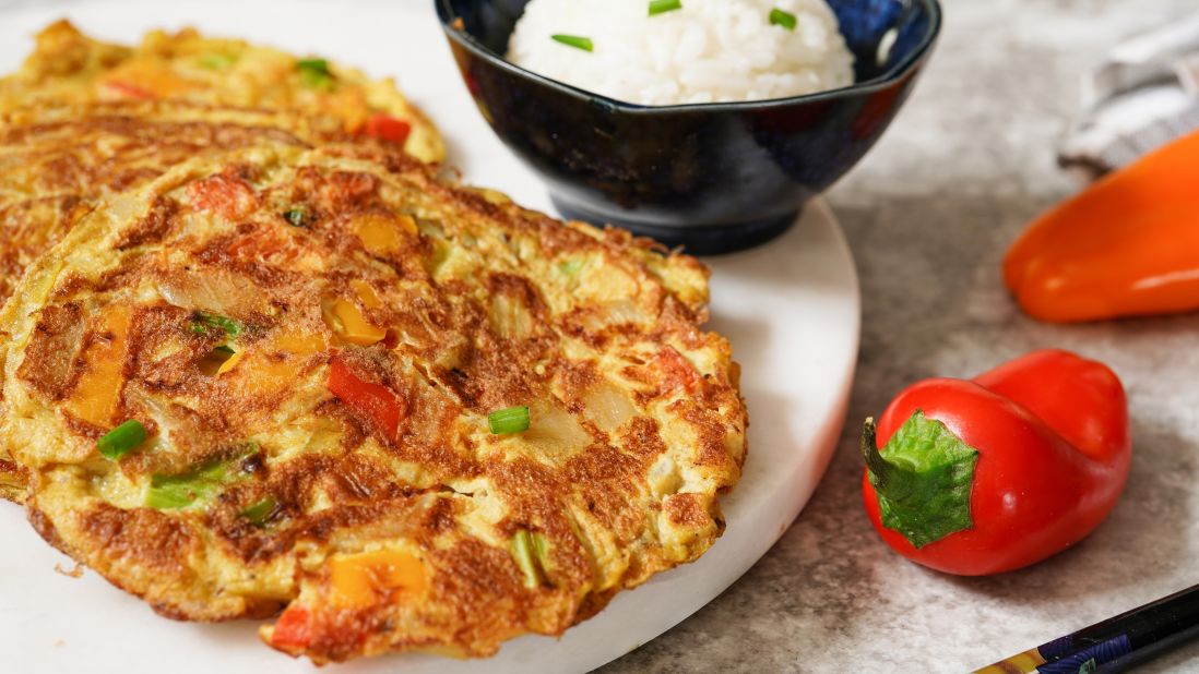 <strong>Egg foo yung</strong>:  A kind of golden omelet, this Chinese dish is filled with bean sprouts, onions or scallions, minced meat or seafood and served with a sauce boat of brown gravy.