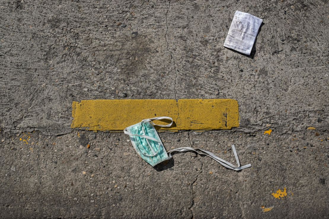 A surgical mask littered on the street.