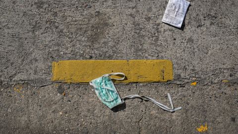 A surgical mask littered on the street.