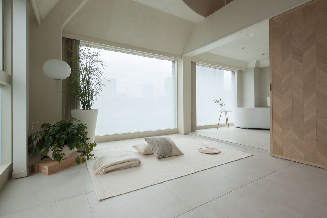 Japanese architecture firm HOAP used sliding screens to divide up this 366-square-foot apartment in Tokyo.