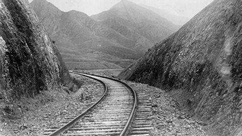 A railway cutting through the hills of Manchuria, circa 1906.