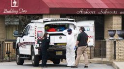 ANDOVER, NJ - APRIL 16: Medical workers put on masks and personal protective equipment (PPE) while preparing to transport a deceased body at Andover Subacute and Rehabilitation Center on April 16, 2020 in Andover, New Jersey. After an anonymous tip to police, 17 people were found dead at the long-term care facility, including two nurses, where at least 76 patients and 41 staff members have tested positive for COVID-19. (Photo by Eduardo Munoz Alvarez/Getty Images)