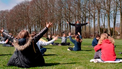 Teacher Rebekka Hjorth has a music lesson with her class outdoors at the Korshoejskolen public school in Randers, Denmark, on April 15.