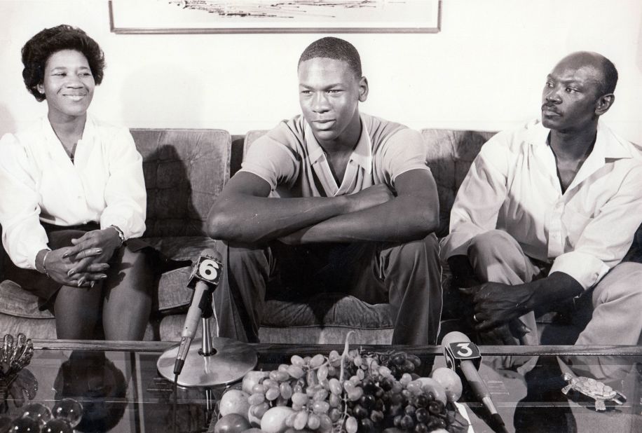 Jordan sits with his parents, Deloris and James, on the day he announced that he would be playing college basketball at the University of North Carolina.