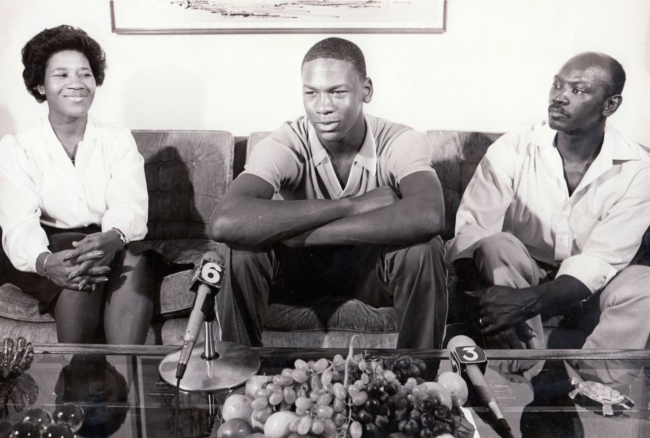 Jordan sits with his parents, Deloris and James, on the day he announced that he would be playing college basketball at the University of North Carolina.