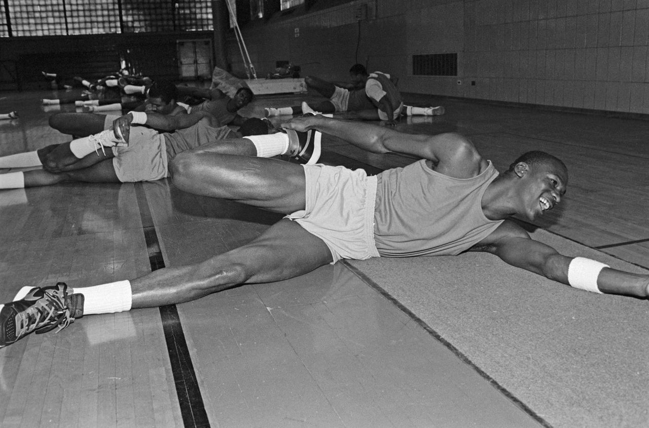 Jordan does stretches during his first workout with the Bulls.