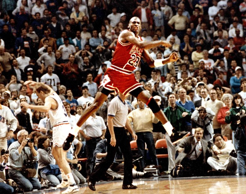 Jordan celebrates after hitting a buzzer-beating basket to knock Cleveland out of the NBA playoffs in 1989. The play became known as "The Shot," and it was remembered for Jordan's fist-pump celebration and the dejection of Cleveland's Craig Ehlo.