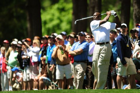 Jordan hits a golf shot while playing in a pro-am event in Charlotte, North Carolina, in 2010. A month earlier he bought the NBA's Charlotte franchise, becoming the second black majority owner of a major professional sports team.