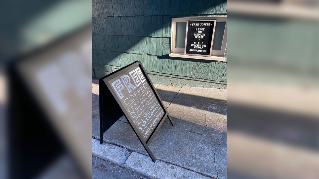 A sign sits in front of Ramirez's kitchen window offering free coffee.