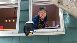 Ben Ramirez hands out free cups of coffee to essential workers and neighbors in San Francisco.