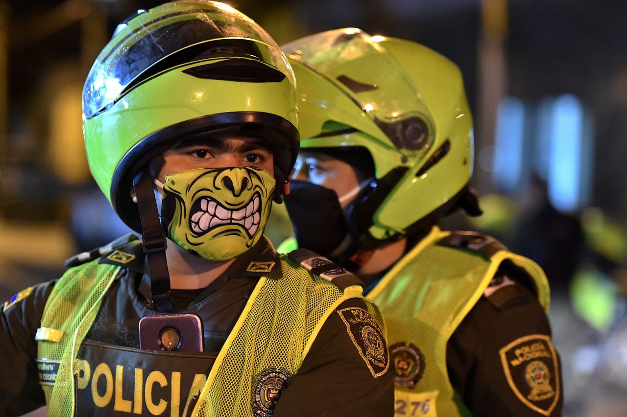 Police officers wear face masks in Cali, Colombia.
